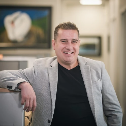 Ryan Gosse, Partner at JMG Accounting pictured here smiling in the office